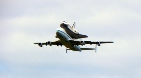 Space Shuttle Discovery flies over Washington, DC.