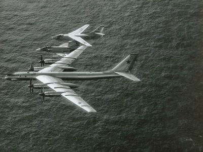 In a photo he calls “The Sandwich,” John Newlin flies his Phantom between a Soviet Tu‑95 Bear and a Douglas A-3 tanker 150 miles west of Gibraltar, April 1, 1966.