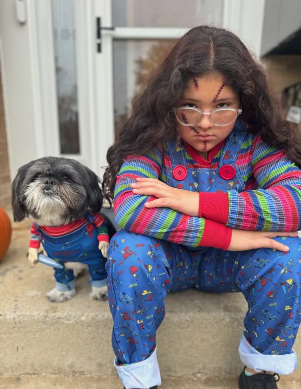 Little girl and her best friend dressed for Halloween thumbnail