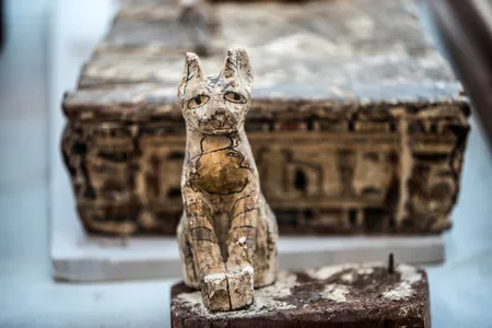 A cat statue is displayed after the announcement of a new discovery carried out by an Egyptian archaeological team in Giza's Saqqara necropolis.