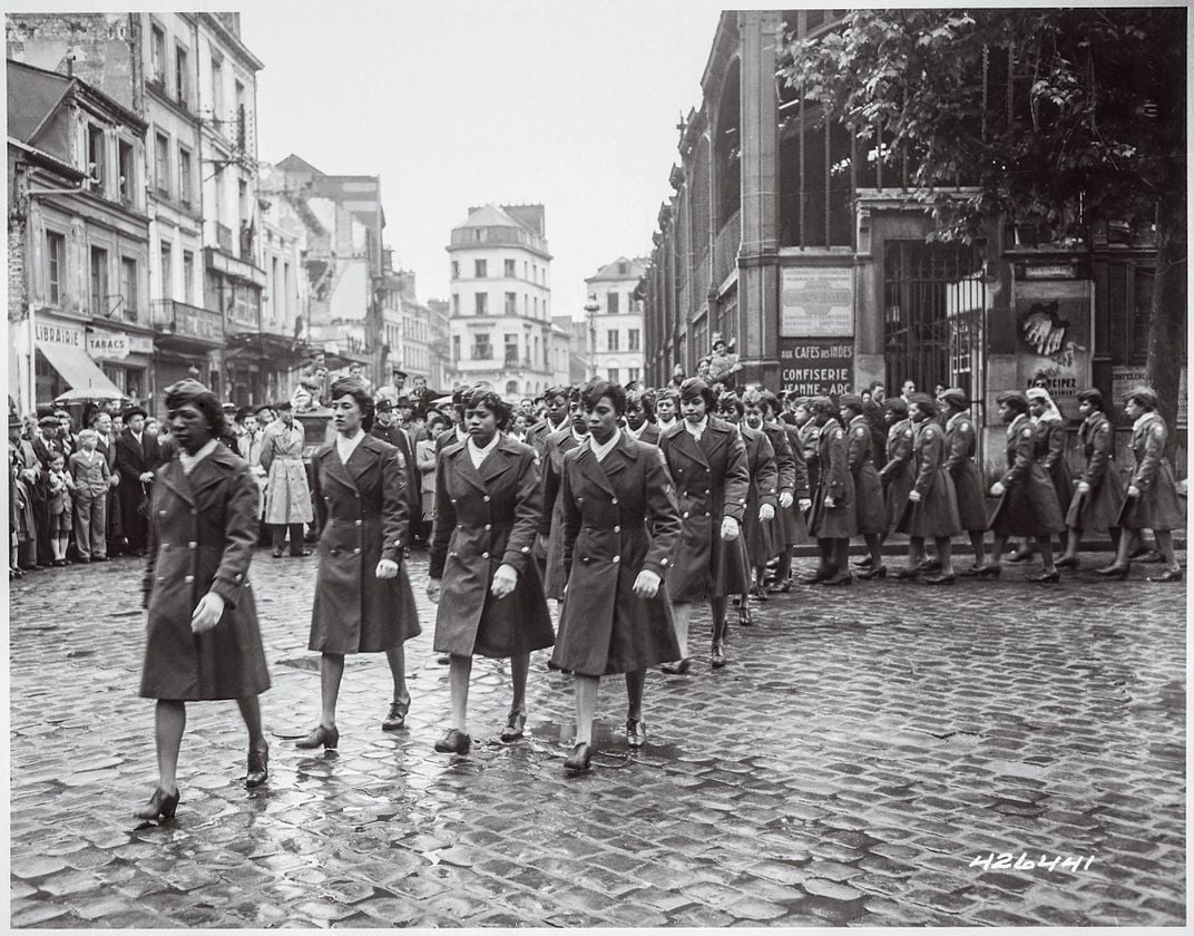 an all Black woman military marches in France during world war two