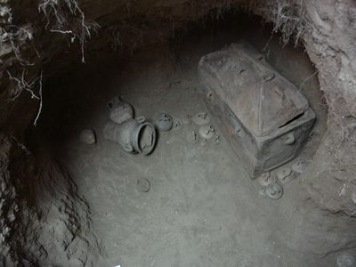 The eight-foot-deep pit contained two ancient coffins and an array of funerary vases.