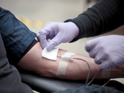 A volunteer donates blood during an event at the Field Museum in Chicago in May, 2020.