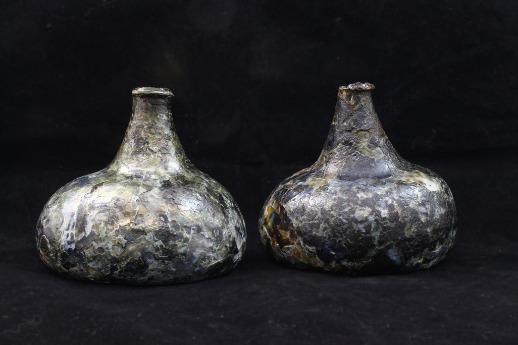 Bottles against a black backdrop