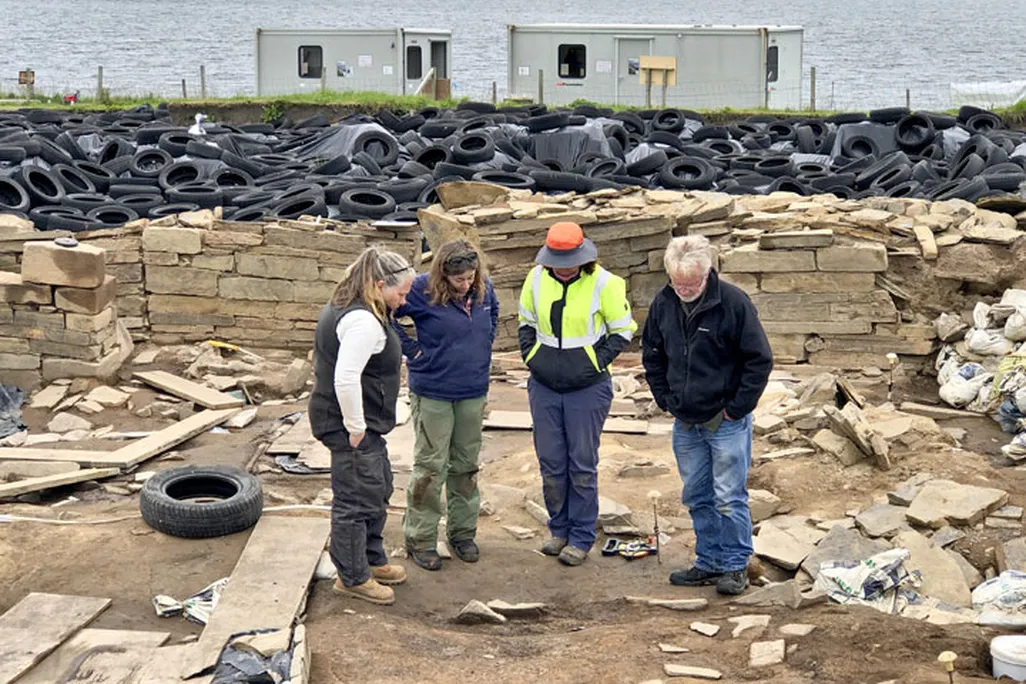 Archaeologists with post-holes