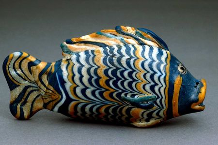 This glass fish was found in a fairly modest private house in Amarna, buried under a plaster floor along with a few other objects. It may once have contained ointment.