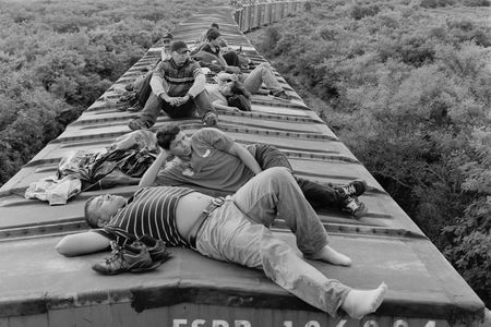 Central American migrants ride a northbound cargo train through the southern Mexican state of Oaxaca. July 2010.