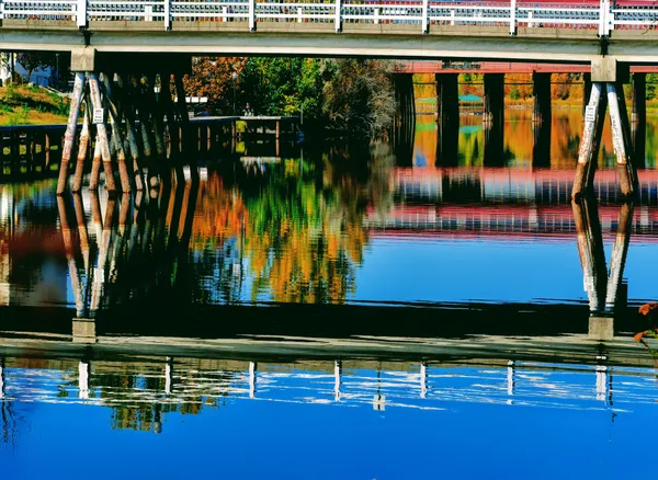 Autumn Multicolored Reflections on The Surface of The Coeur d’Alene River thumbnail