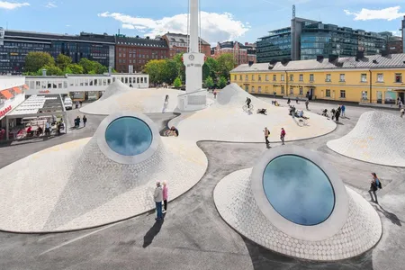 Domed skylights offer tantalizing glimpses into the Amos Rex museum's sprawling underground galleries.