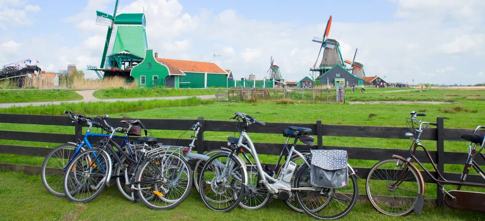 Traditional Dutch landscape of countryside, windmills, and bicycles 