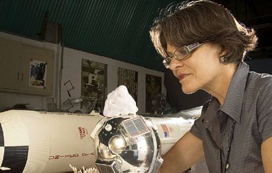 Conservator Hanna Szczepanowska assesses the solar cells on a replica Vanguard satellite; the original will remain in orbit until at least 2109.