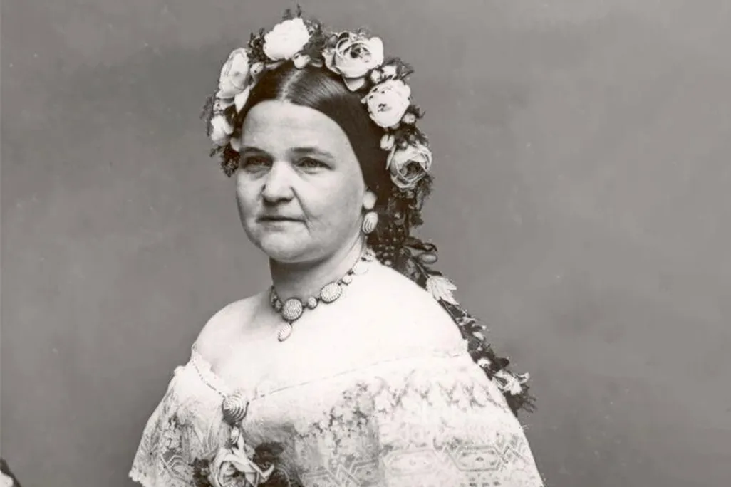 A black-and-white portrait of Mary Lincoln wearing flowers in her hair