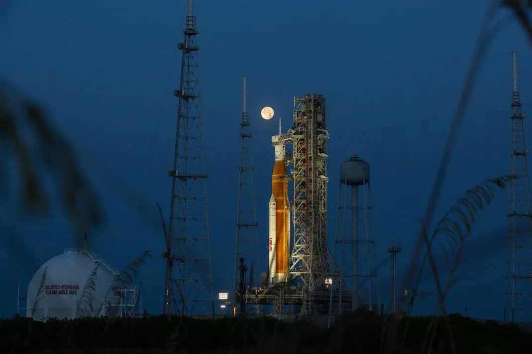 The SLS rocket with a full moon