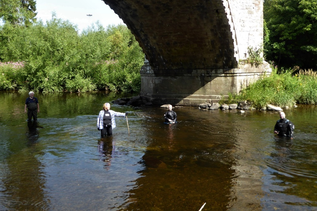 researchers examine the bridge remains