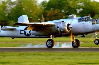 B-25J "Pacific Princess" touches down at the National Museum of the United States Air Force shortly after sunrise on April 17, 2010. The ship was one of 17 that departed Urbana's Grimes Field at two minute intervals for the short flight to the field which is part of Wright-Patterson Air Force Base in Dayton, Ohio. Four of the surviving members of the Doolittle Raiders met the aircraft. The weekend events coincide with the Doolittle Raider reunion being held in Dayton commemorating the 68th anniversary of the Jimmy Doolittle-led bombing mission to Tokyo, Japan launched from the aircraft carrier U.S.S. Hornet. "Pacific Princess", out of China, California, is owned by Carl Scholl and Tony Ritzman.