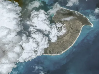 A photo of the Hunga Tonga-Hunga Ha&rsquo;apai volcanic eruption taken on December 24, 2021, before the biggest eruption on January 15, 2022. Tsunamis caused by the eruption killed at six people in Tonga and Peru and displaced more than 1,500 people on Tongan islands.