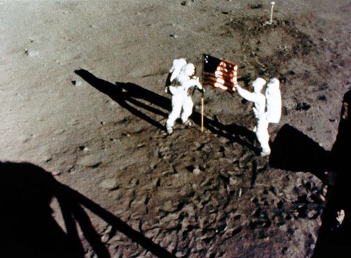Armstrong and Aldrin plant the U.S. flag on the moon, July 1969.