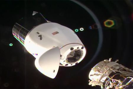 The SpaceX Cargo Dragon capsule separating from the International Space Station after undocking from the Harmony module’s international docking adapter. 