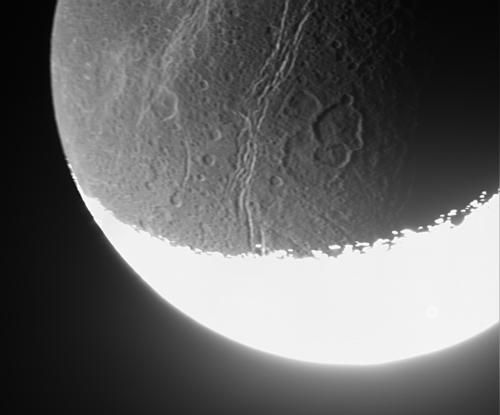 Cassini captures the dim light from a distant moon.