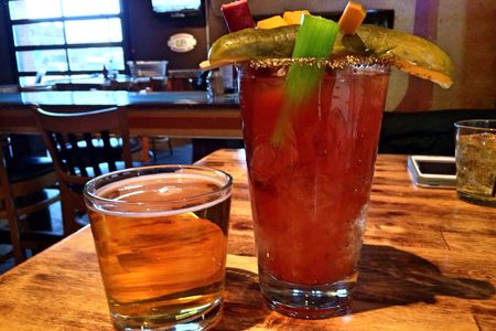 A Bloody served in a bar, loaded with goodies and with a beer chaser. 
