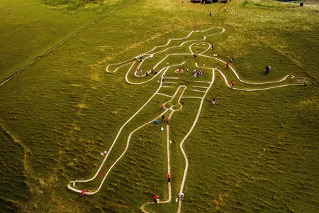 Volunteers repairing and refreshing the 180-foot-tall giant in 2019