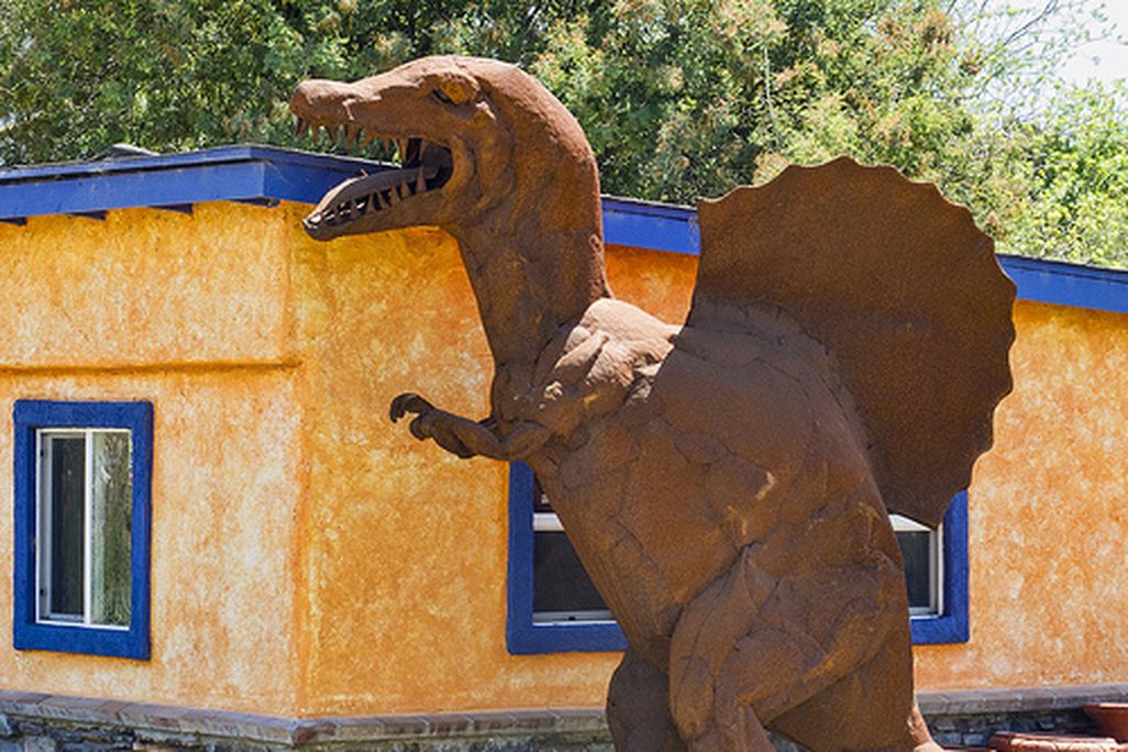 A Spinosaurus sculpture near an ice cream shop in California.