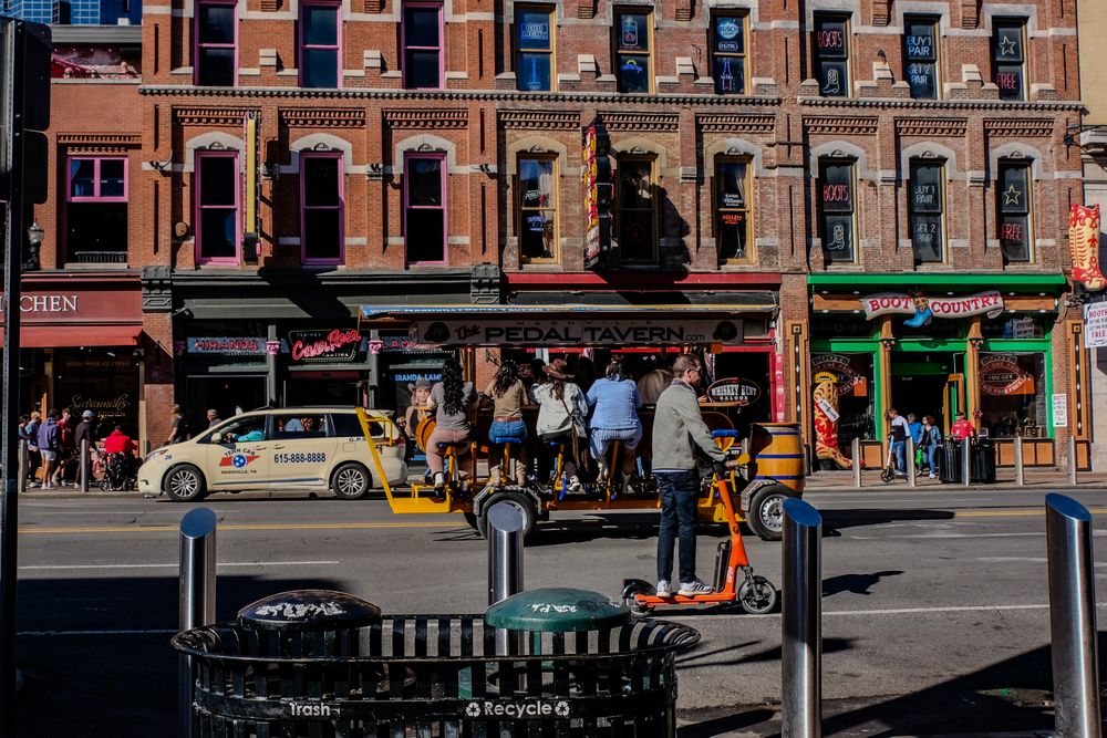 A man on a scooter in the street