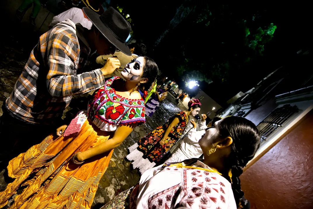 Performers prepare for a parade