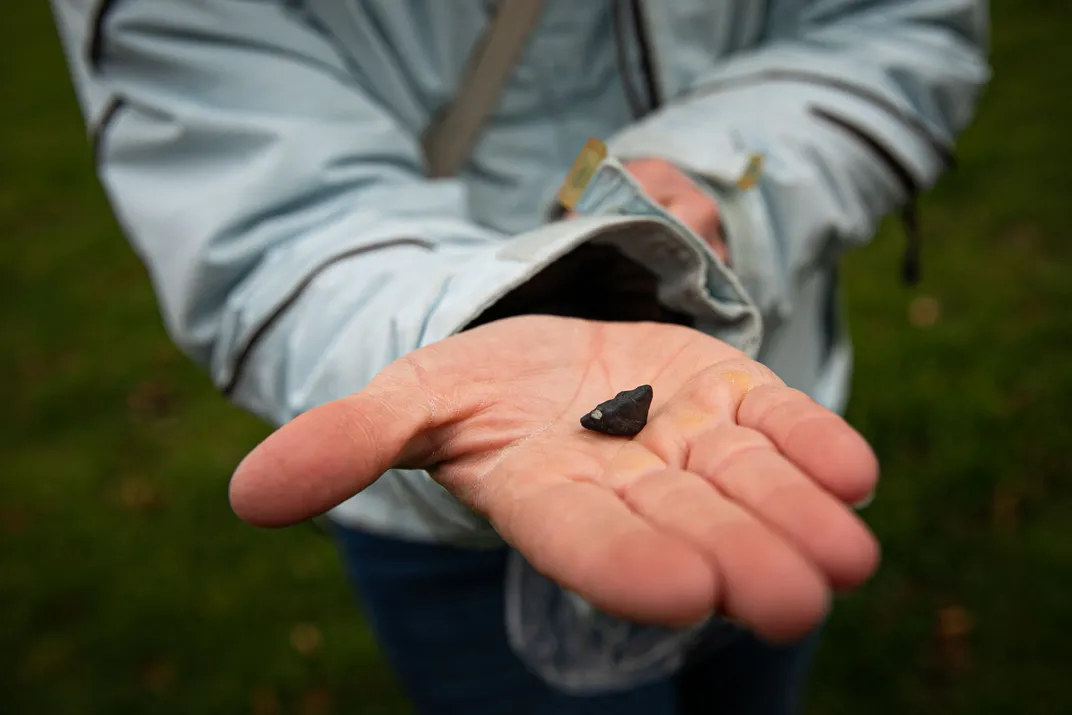 A meteorite in a person's hand