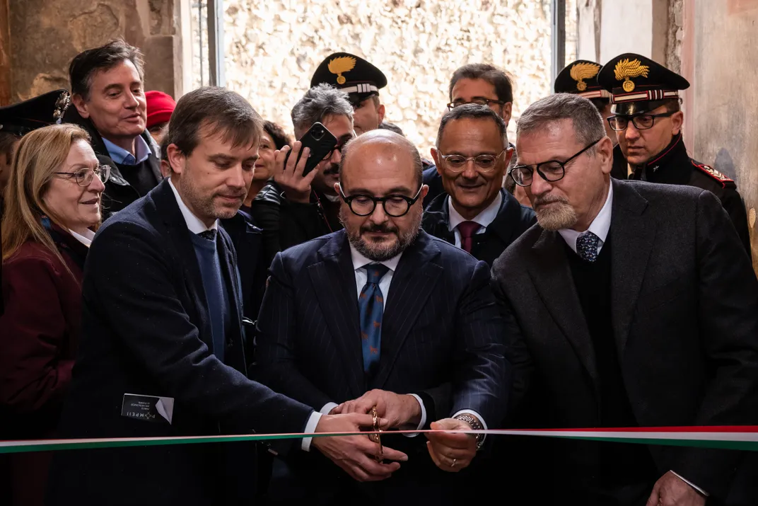 Italian Minister of Culture, Gennaro Sangiuliano (C), cuts the ribbon at the Archaeological Park of Pompeii