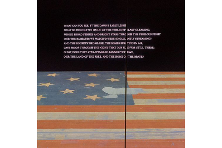 The first stanza of the national anthem is projected prominently on the wall above the Star-Spangled Banner in the museum. (NMAH)