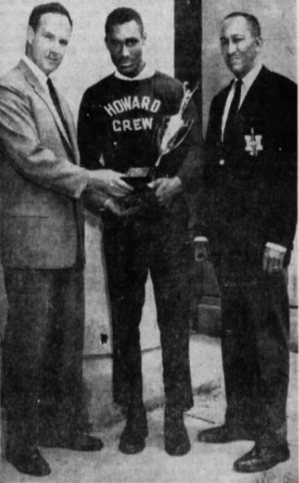 Reggie Young (center) holds the first-place trophy won by Howard at the 1964 D.C. Regatta.