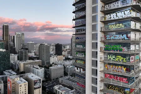 An aerial view of the freshly graffitied Oceanwide Plaza skyscraper development in downtown Los Angeles