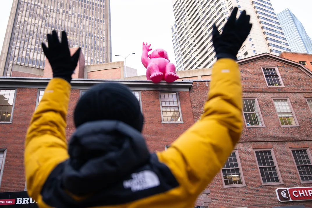 Pink man waving
