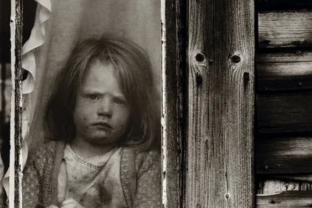 A young Walden resident, circa 1974, appears none too happy about being kept inside, or having her picture taken.