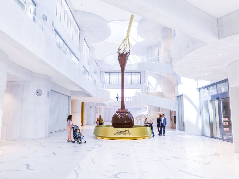 The entrance to the Lindt Home of Chocolate includes a 30-foot chocolate fountain topped with a giant golden whisk 