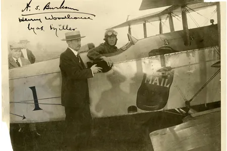For the first New York-to-Chicago mail flight, in 1918, Max Miller accepts a mailbag from New York City Postmaster Thomas Patten.