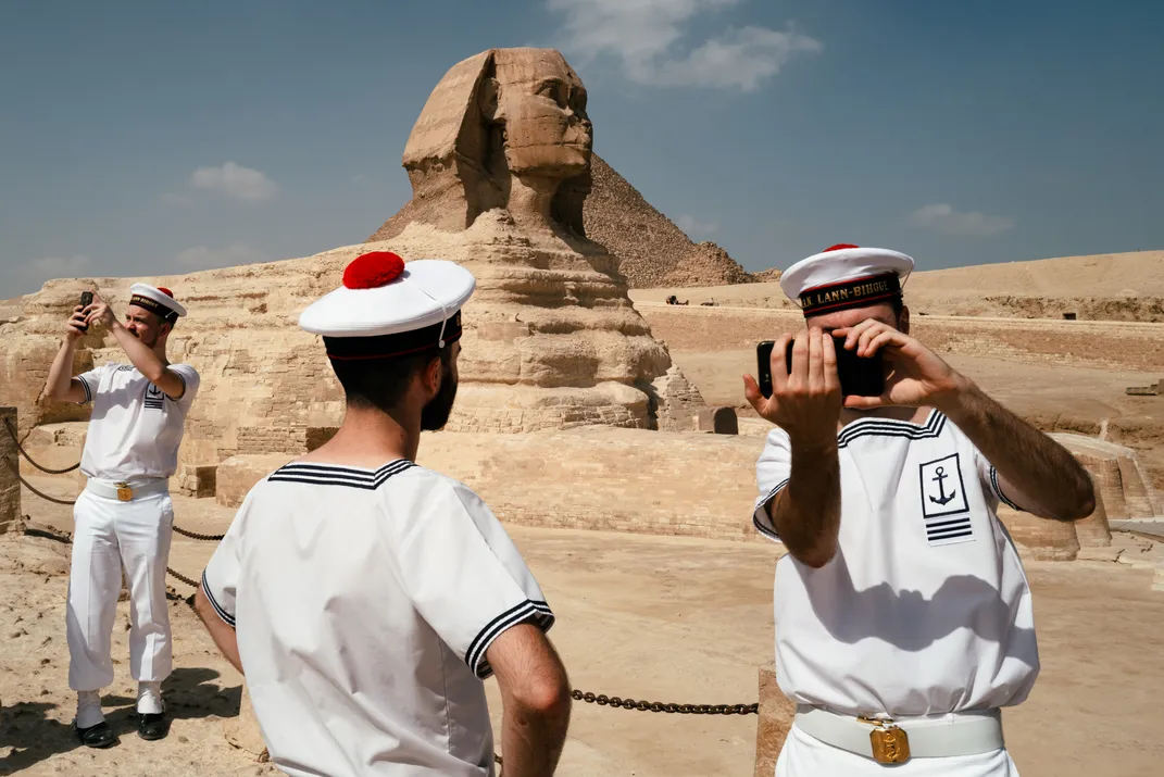 7 - With travel at a minimum due to the Covid-19 pandemic, French Navy bagpipe band members visit the Sphinx with few other tourists around.
