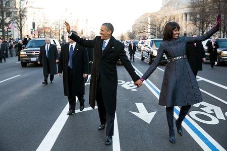 Barack and Michelle Obama walk down Pennsylvania Avenue together on Inauguration day, 2013.