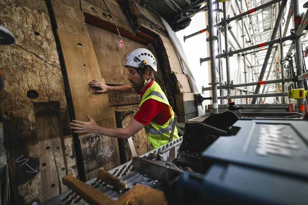 Man repairs HMS Victory
