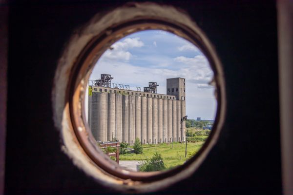 Grain silos through port hole thumbnail