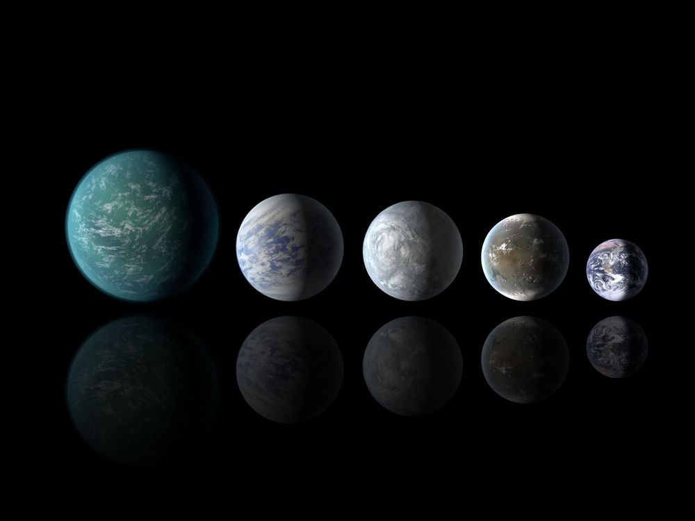 Artists illustrations of the previously known Kepler 22b, and the new 69c, 62e and 62f line up next to Earth.