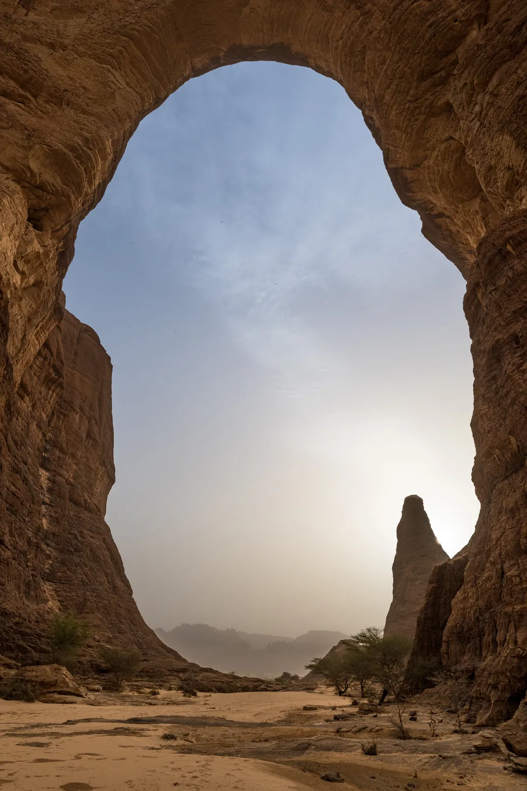 The Aloba Arch, at 400 feet tall and more than 250 feet across, is one of the world’s tallest and widest natural rock arches.