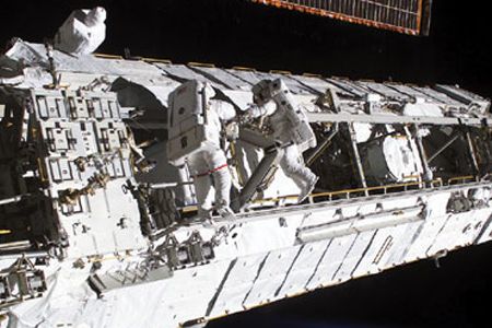 Astronauts attach the Port 1 truss to the International Space Station in 2002.