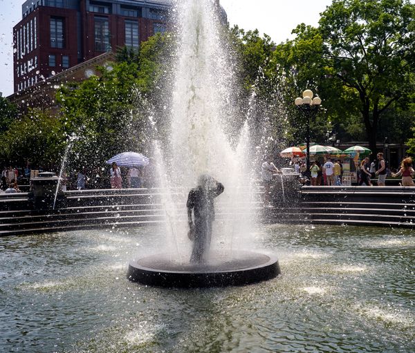 Homeless man in fountain during heatwave thumbnail