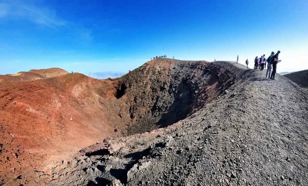 Hiking along the crest of a crater at Mt. Etna