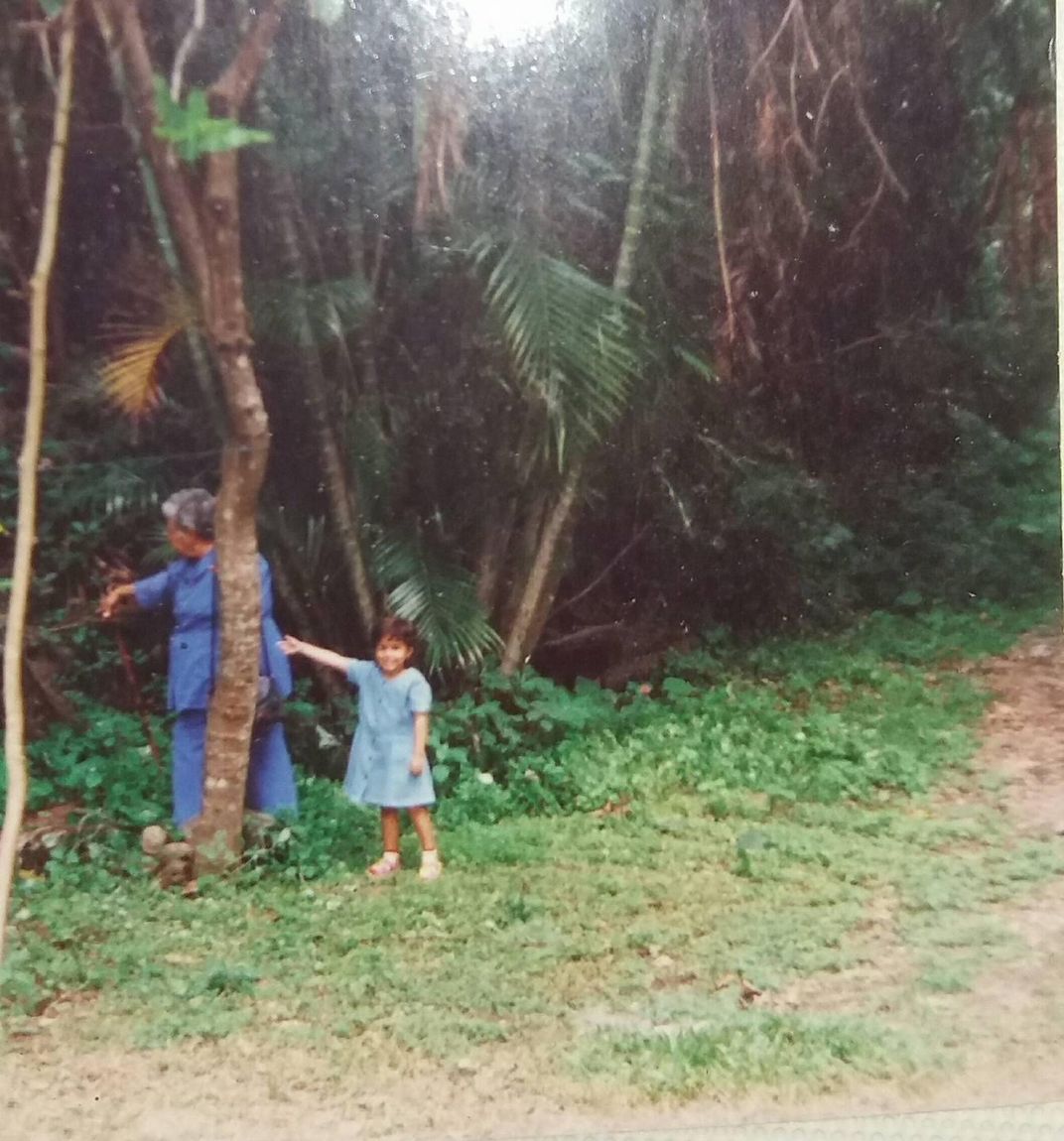 a young girl on the edge of a forest with an older woman