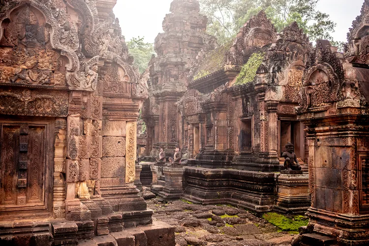 The tenth-century temple of Banteay Srei, northeast of Angkor, where Clara and Andr&eacute; Malraux planned an audacious 1923 heist. The Hindu shrine complex, built from intricately carved red sandstone, is celebrated for some of the finest surviving decorative stonework of the Khmer era.
