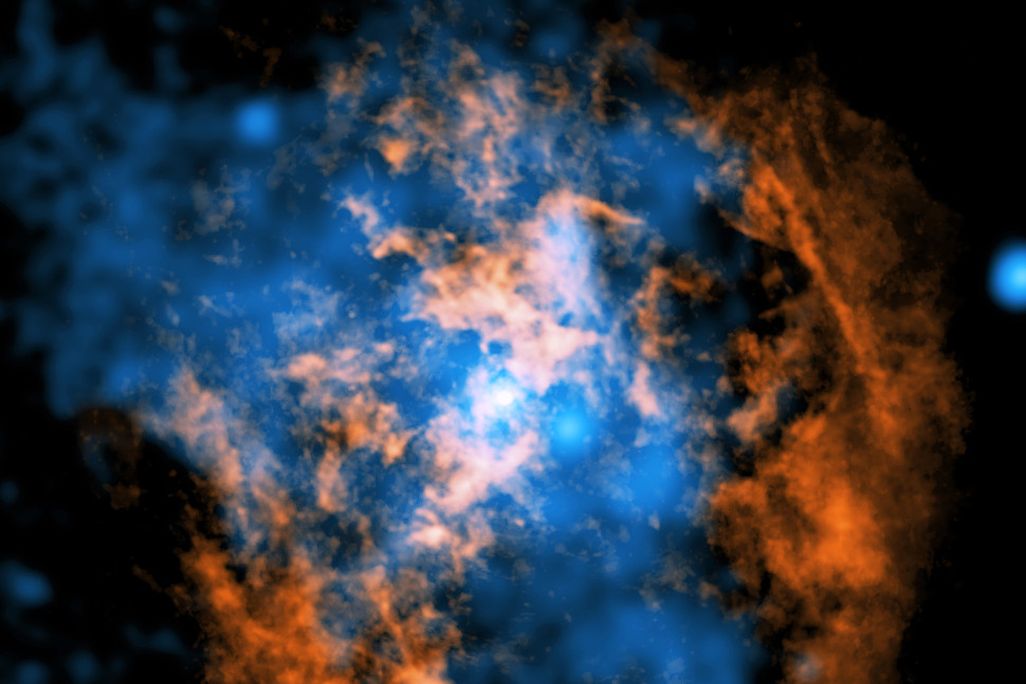 image of wind blowing away from a supermassive black hole