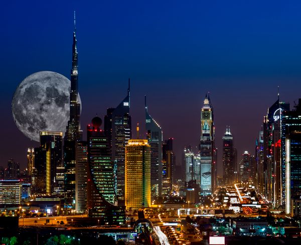 Big moon shining on Burj Khalifah - Dubai thumbnail